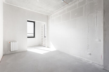 interior of the apartment without decoration in gray colors. rough finish