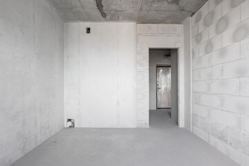 interior of the apartment without decoration in gray colors. rough finish