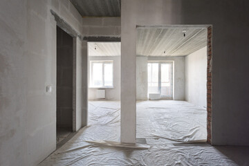 interior of the apartment without decoration in gray colors. rough finish