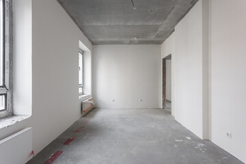 interior of the apartment without decoration in gray colors. rough finish