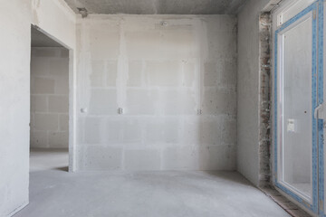 interior of the apartment without decoration in gray colors. rough finish