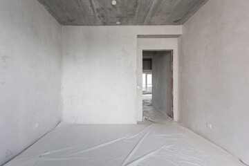 interior of the apartment without decoration in gray colors. rough finish