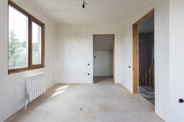 interior of the apartment without decoration in gray colors. rough finish