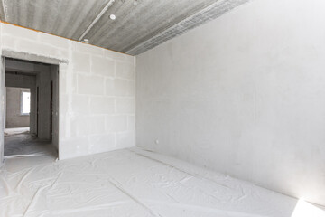 interior of the apartment without decoration in gray colors. rough finish