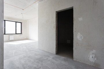 interior of the apartment without decoration in gray colors. rough finish