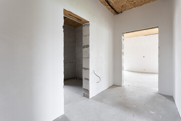 interior of the apartment without decoration in gray colors. rough finish