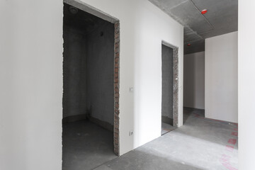 interior of the apartment without decoration in gray colors. rough finish
