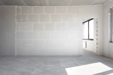 interior of the apartment without decoration in gray colors. rough finish