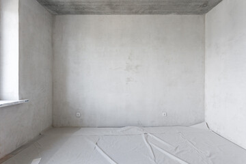 interior of the apartment without decoration in gray colors. rough finish