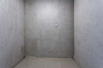 interior of the apartment without decoration in gray colors. rough finish