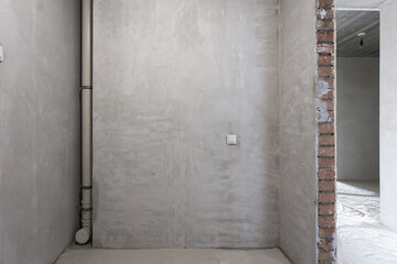 interior of the apartment without decoration in gray colors. rough finish