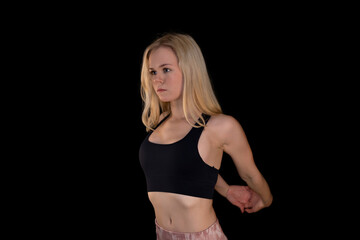 Fit Young Girl Stretching in Sportswear for Flexibility and Wellness