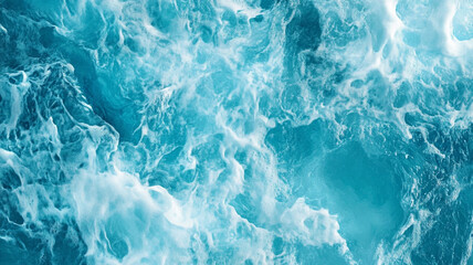 Fototapeta premium Bright turquoise ocean waves create a dynamic texture on a sunny day at the beach
