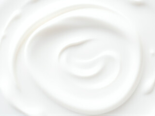 Creamy white texture swirls in a smooth pattern, creating a soothing background for culinary or beauty purposes