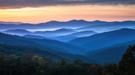 Obraz premium Serene Sunrise Over Mountain Range with Soft Light