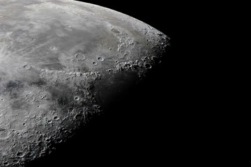 High-resolution lunar photograph capturing the Moon's craters, detailed surface features, and...