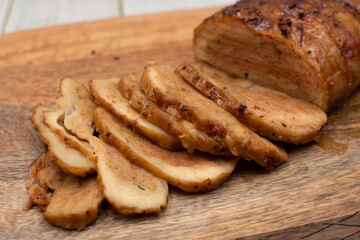 Seitan: vegan meat alternative made of washed flour gluten spices. Roasted and served on wooden board