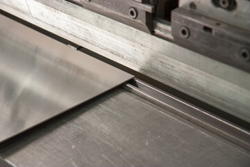 Aluminum Press Brake machine up close in detail with 3 millimeter aluminum 90 at a hydraulic press.