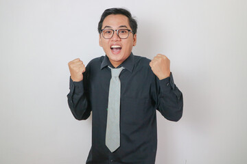 Asian office man wearing black shirt doing success gesture, isolated white office man concept.