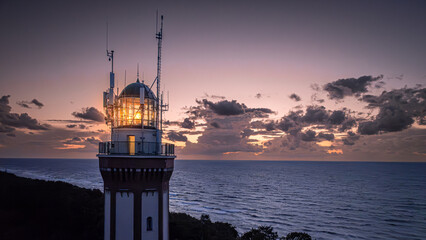 Light beam from lighthouse by Baltic Sea.