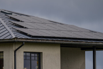 Privat property solar panels for green energy set up on home roof for private use and independent energy source