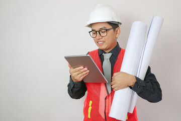 Asian engineer portrait with tablet and blueprint paper on white background.