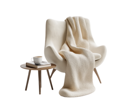 White chair with a blanket draped over it and a book on a table. on Isolated transparent background