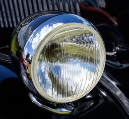 Old-Timer Headlight of a black vintage car