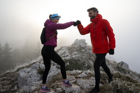 Runner couple having fun after trail cross-country trail running training