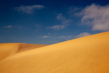 Sand dunes in Namibia with blue sky