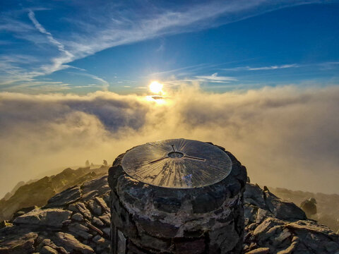 Breathtaking Sunrise Above the Clouds on Snowdon Summit, Snowdonia National Park in Wales