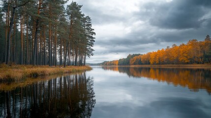 Obraz premium Serene Autumn Reflections on a Tranquil River Surrounded by Nature
