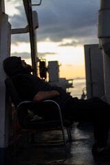 Sleeping man on board a ferry