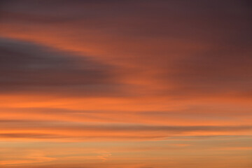 Early morning sky before sunrise in beautiful orange and red colors.