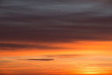 Early morning sky before sunrise in beautiful orange and red colors