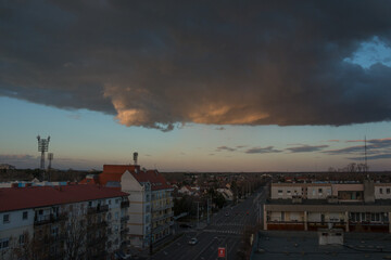 Storm clouds are gathering above the city.