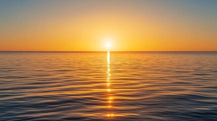 Obraz premium Serene Sunset Over Calm Ocean Waters with Vibrant Orange and Yellow Sky Reflected on Gentle Waves Creating a Peaceful Seascape at Dusk