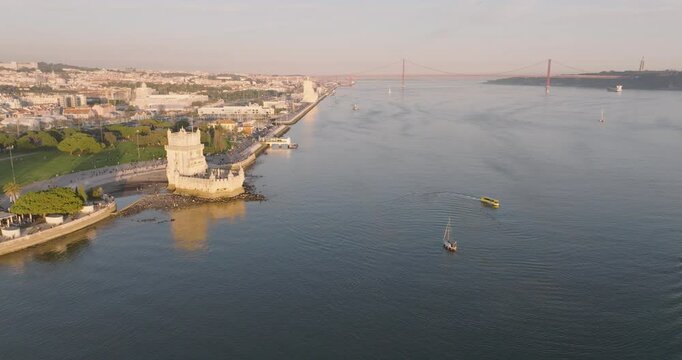 Aerial drone shot of the Tower of Belem, Torre de Bel&eacute;m, Tower of Saint Vincent, in Lisbon, Lisboa, Portugal, Europe. Golden hour right before sunset in winter. Shot in ProRes 422 HQ