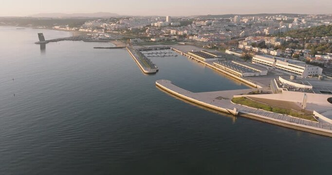 Aerial drone shot of Doca de Pedrou&ccedil;os marina in Belem, Lisbon, Portugal, Europe. Golden hour before sunset. Shot in ProRes 422 HQ