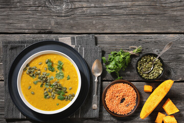 Pumpkin Red Lentil Soup in white bowl, top view