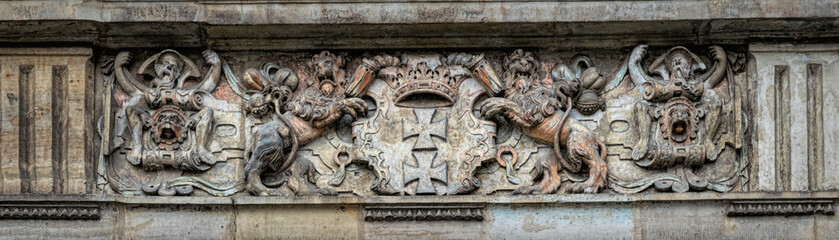 Medieval stone panel with lions and royal coat of arms