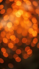 Fototapeta premium Vivid orange bokeh lights creating a soft and dreamy background, glowing