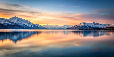 Obraz premium Serene Sunset Reflection on a Still Mountain Lake