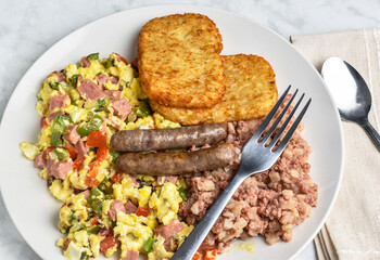 scramble eggs  with  corn beef hash and  sausages