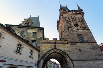 Medieval towers in the monumental city of Prague at the entrance to Charles Bridge, Czech Republic.