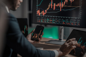 Excited businessman reacts to rising stock graph with screen The stock market is excited when stock prices soar! It's an exciting time. They are optimistic as their portfolios grow.