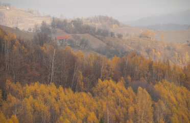 Autumn landscape from Transylvania, Romania. Village from Carpathian Mountains on a cloudy day.
