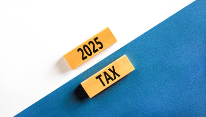 Planning 2025 tax new year symbol. Concept words 2025 Tax on beautiful wooden blocks. Beautiful white and blue background. Business 2025 tax new year concept. Copy space.