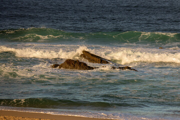 waves breaking on the beach