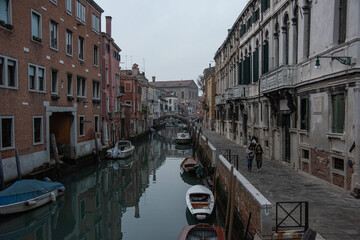 Boats on a back water Venice canal late afternoon in early December